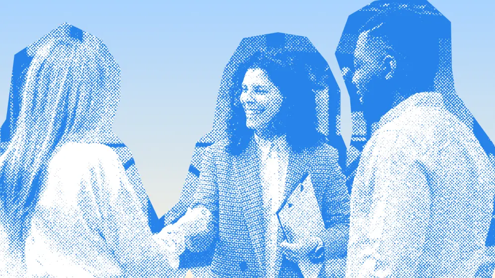 Colleagues in a professional handshake, in a blue duotone treatment