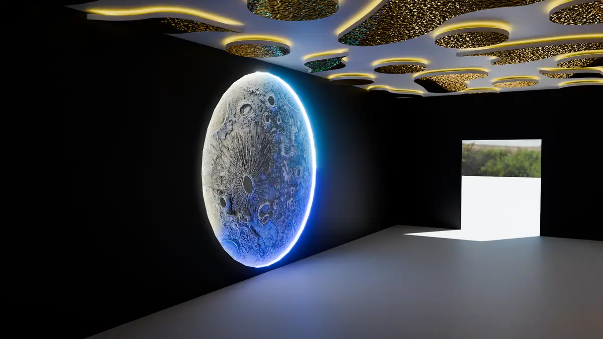 Sculpted moon feature glowing against a dark wall under a gold perforated ceiling