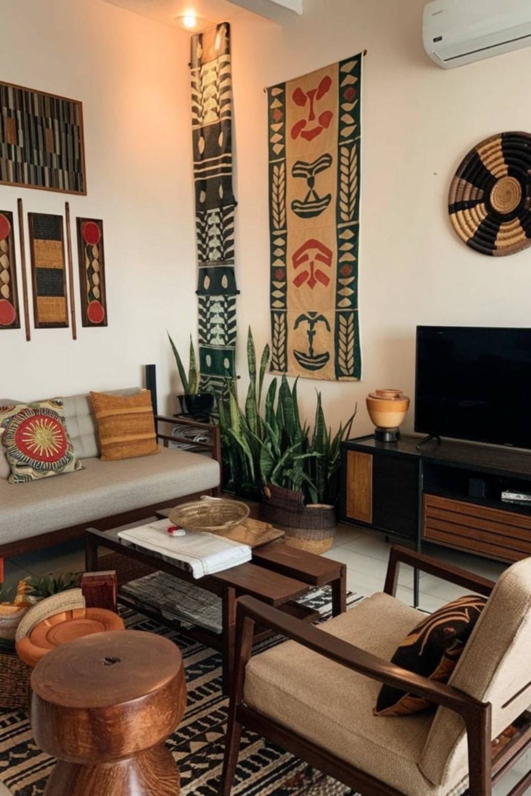 Modern lounge with African art wall and smart TV integration