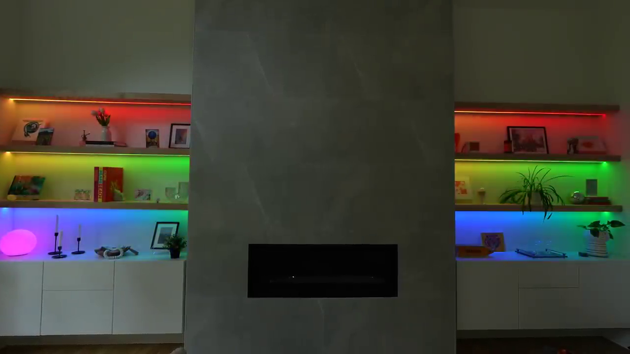 Modern fireplace with RGB-lit floating shelves