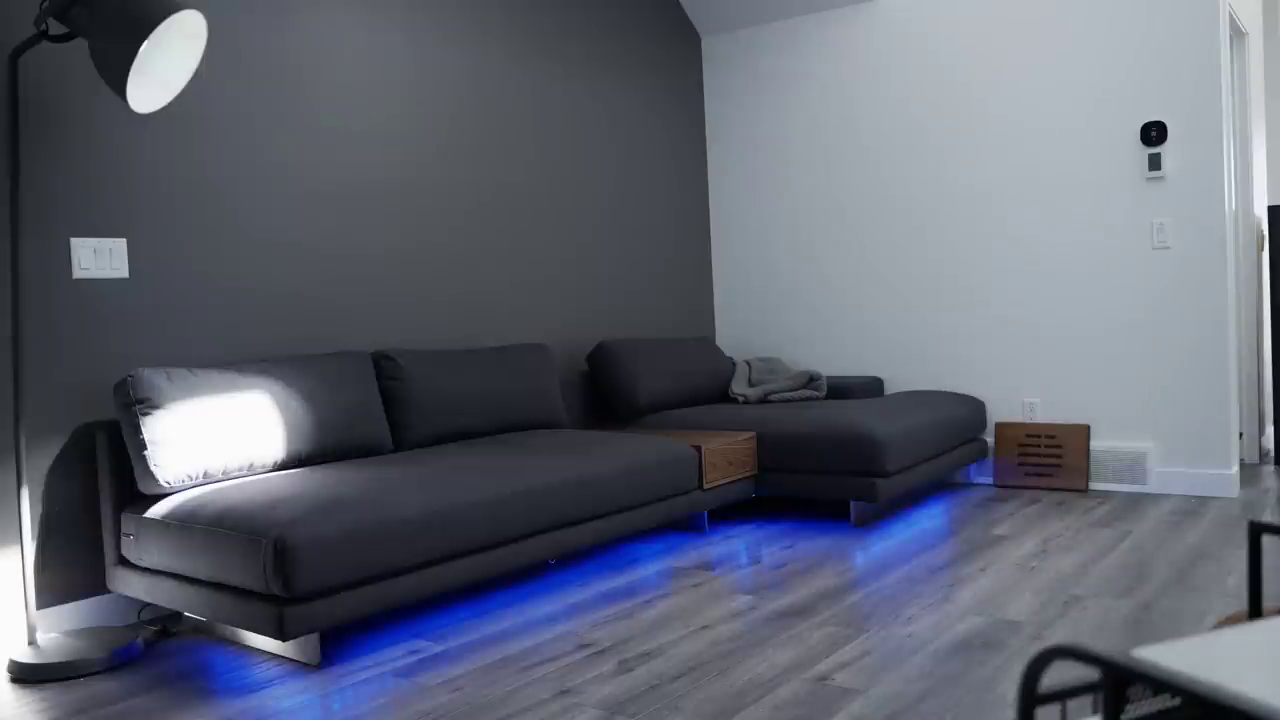 Living room with LED underglow beneath sofa