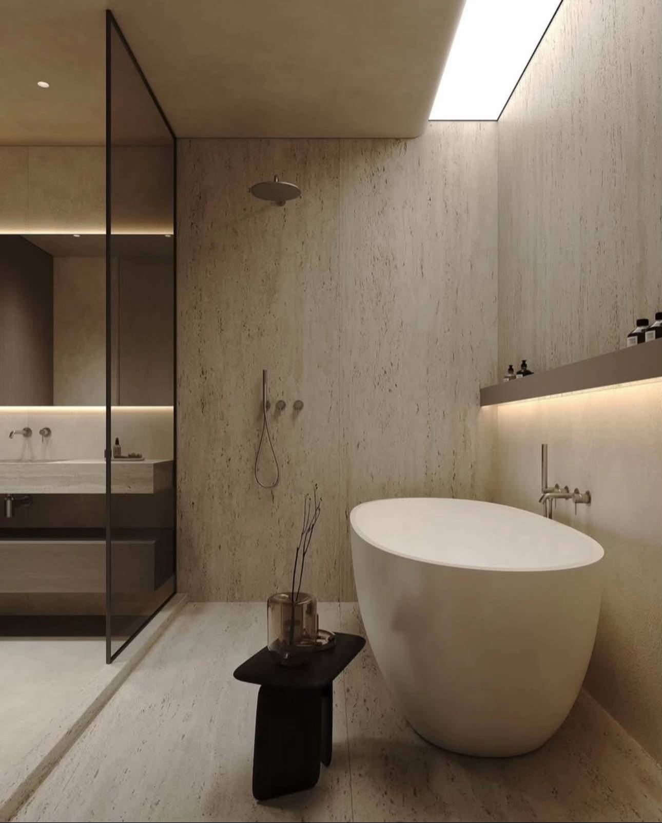 Luxury bathroom with travertine walls and freestanding tub