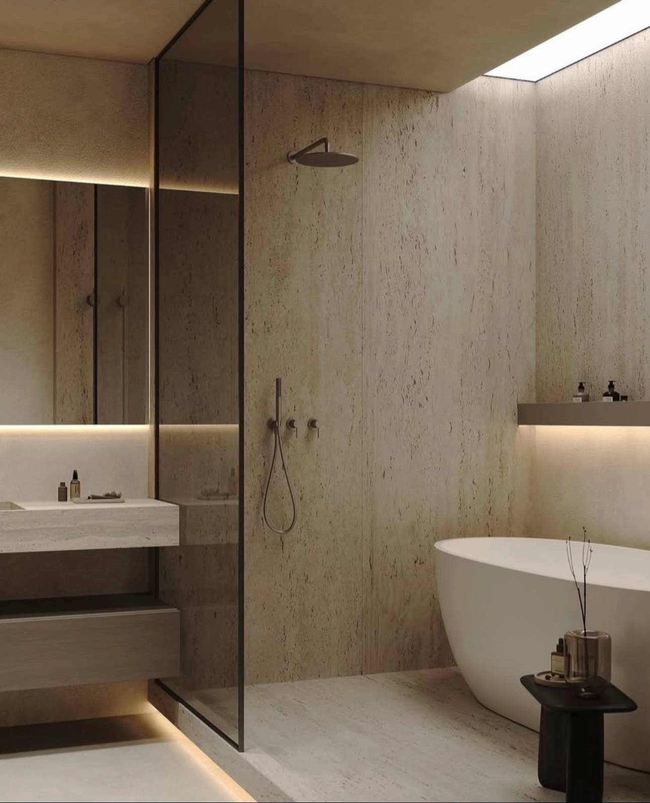 Minimalist travertine shower with glass partition